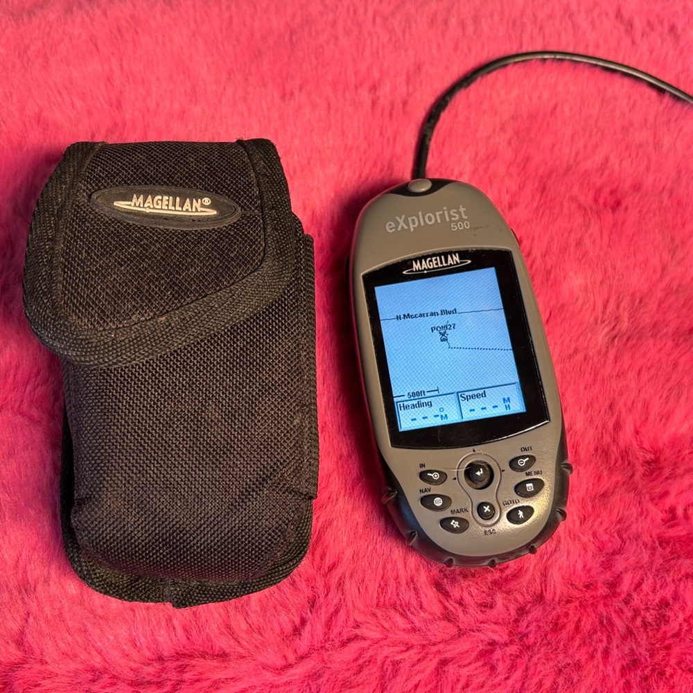 Magellan Explorist 500 Water Resistant Hiking GPS with case and charging cable.